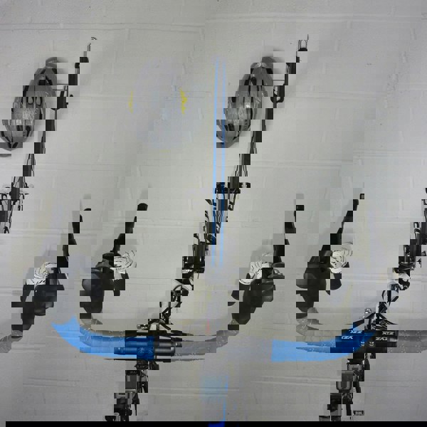 Bike hanger for 1 bike plus helmet, backpack and coat shown with a road bike and helmet