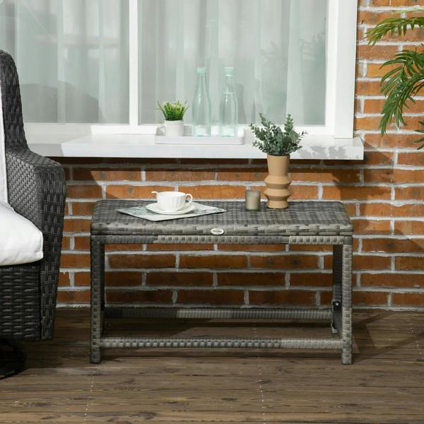 Grey rectangular outdoor side table with woven top, metal frame, and open storage shelf
