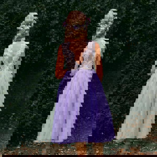 young girl wearing lilac flower girl dress