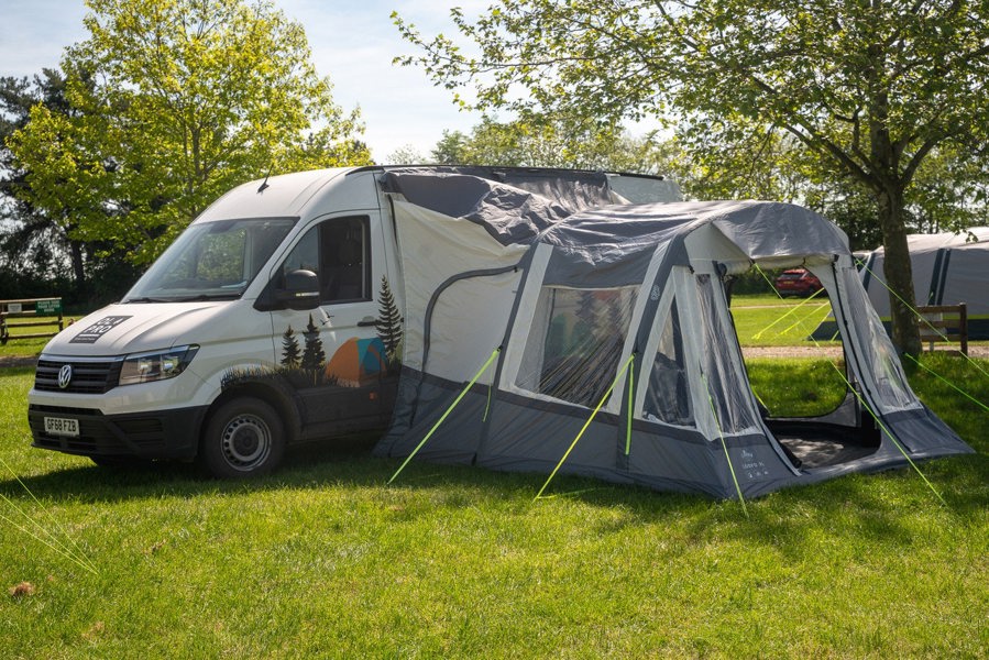 The Loopo Breeze® XL v2 Motorhome Awning on a Volkswagen Crafter Campervan with, the awnings front door is open