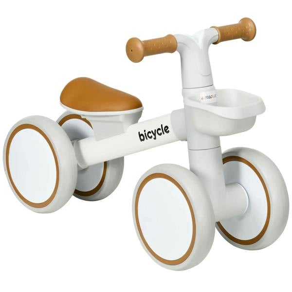 White kids balance bike with brown padded seat, white frame, and wide hand grips