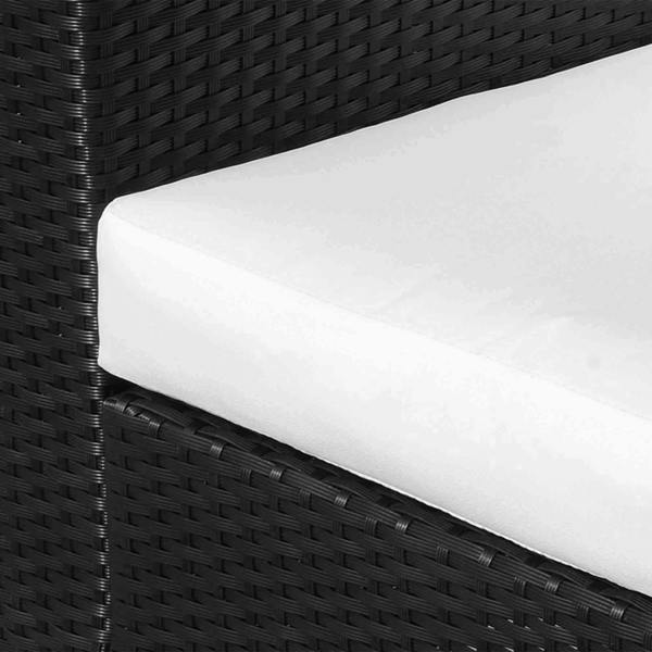 Close-up of white padded cushion on black woven rattan armchair seat