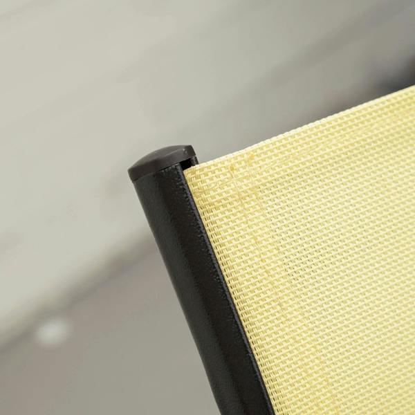 Beige mesh chair backrest corner with black armrest frame detail
