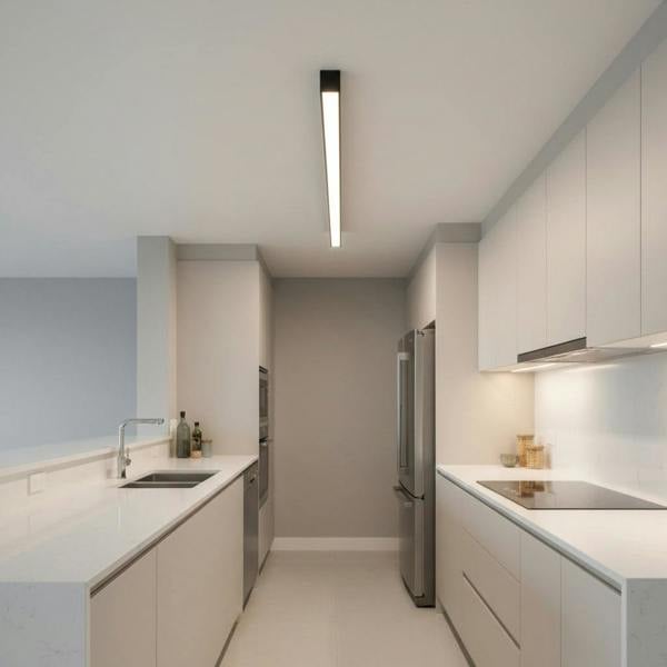 black surface mounted linear light shown in a galley kitchen 