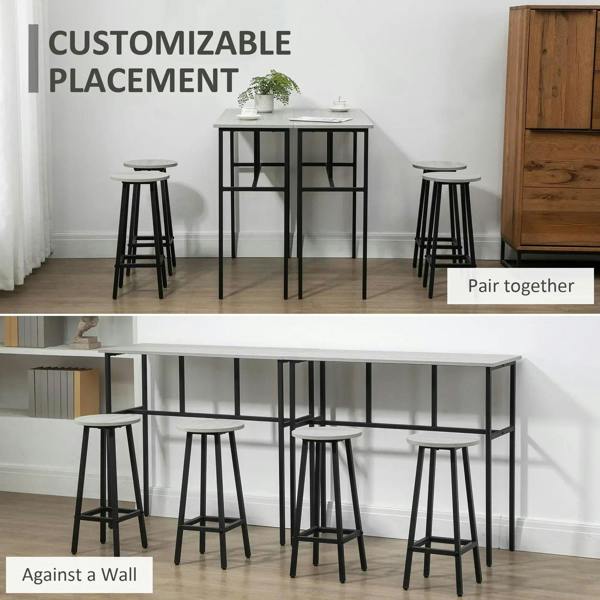 Grey bar tables with four round stools arranged together, black steel frames