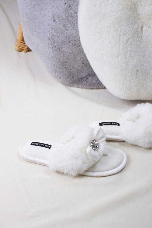 Amelie women's toe post slippers in cream with a premium velvet bow and diamante embellishment atop a plush faux fur band from Pretty You London