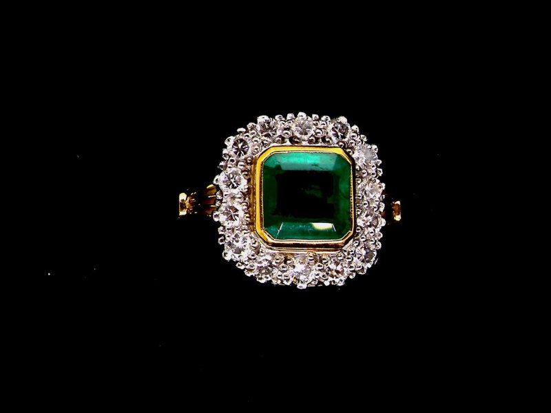 Vintage Tom A fine emerald and diamond cluster ring