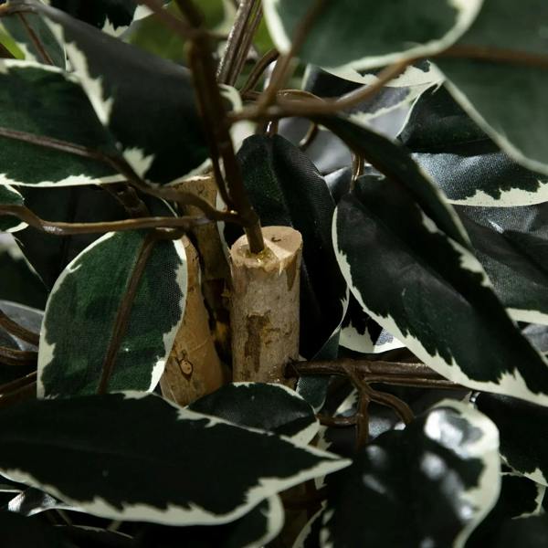 Artificial ficus trunk with speckled bark and dark green leaves in close view