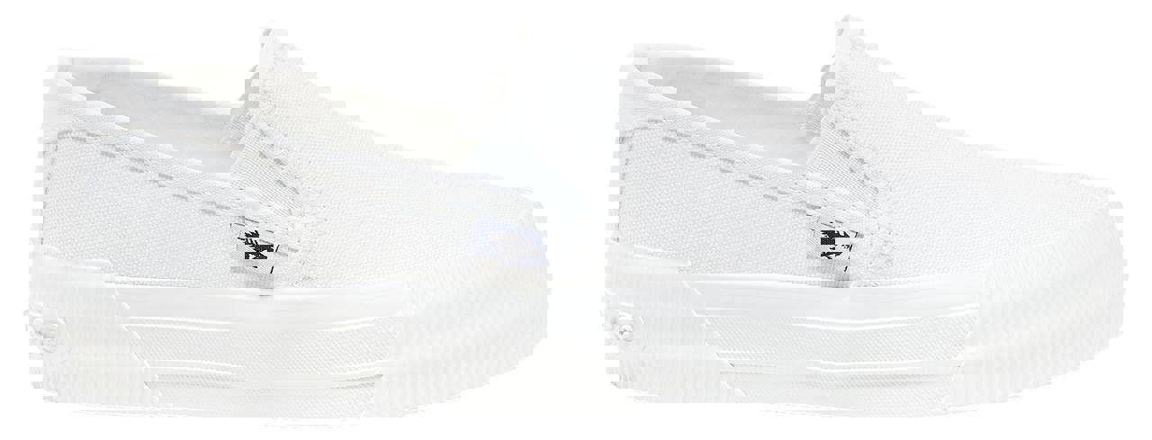 Rocket Dog Cheeryful Womens Slip On Casual Trainers Shoe, white canvas slip-on sneaker with flat sole and logo tag on side.