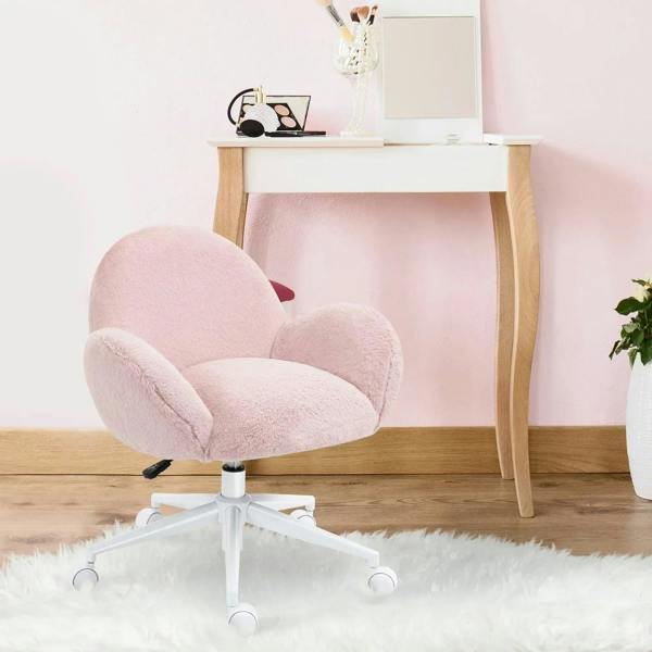 Pink fluffy vanity chair with rolled arms and swivel casters beside a desk