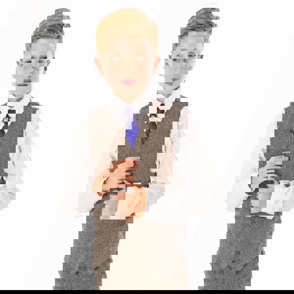 Boy in grey tweed waistcoat and blue tie