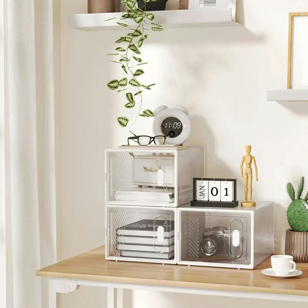 Clear stackable shoe storage boxes with transparent compartments on a display shelf