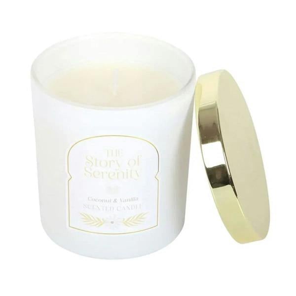 White coconut-and-vanilla candle jar with Serenity label and visible lit wick