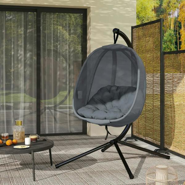 Grey hanging egg chair swing hammock with cushioned seat on tripod-style stand