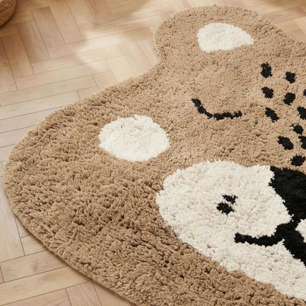 Round rug with a cheetah design on a wooden floor