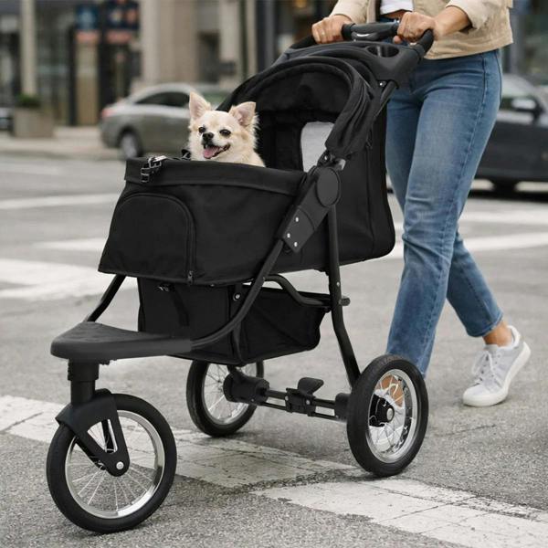 Black pet jogger with a spacious cabin, smooth wheels, and a happy dog inside, designed for comfortable outdoor walks