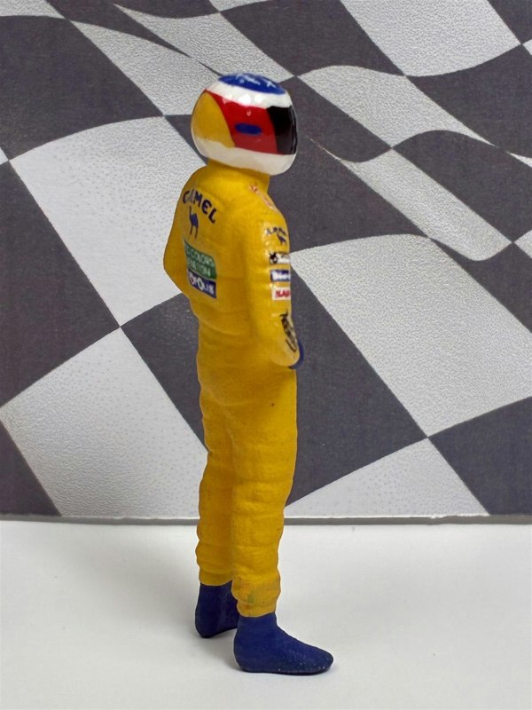 a toy figure of a race car driver