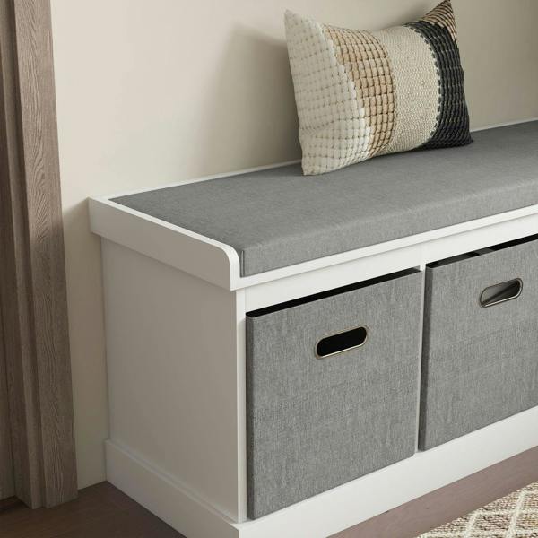 Side view of a white shoe storage bench with padded top and two gray drawers