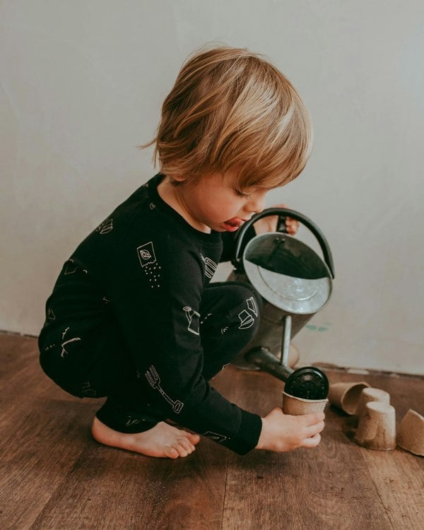 Boy wearing gender-neutral organic cotton kids joggers