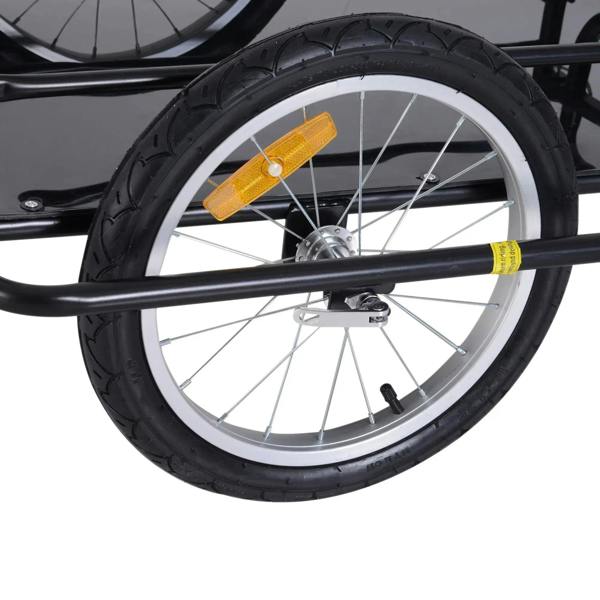 Front wheel of black bike cargo trailer with orange reflector and 16-inch tire