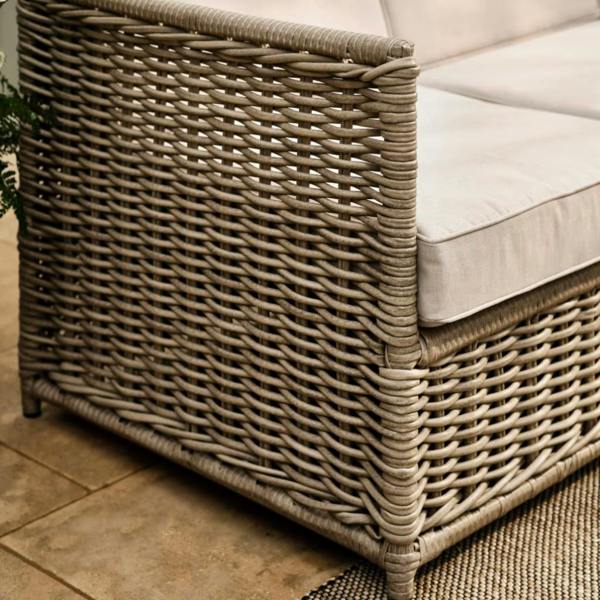 Close-up of handwoven stone-coloured PE rattan weave.