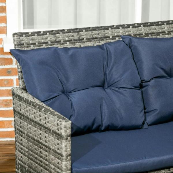 Corner patio sofa with gray woven rattan arms and dark blue tufted cushions