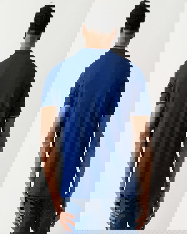 back shot of a model wearing a BOSS Green Tee Mens Stretch Cotton T-Shirt with Contrast Logo in Navy