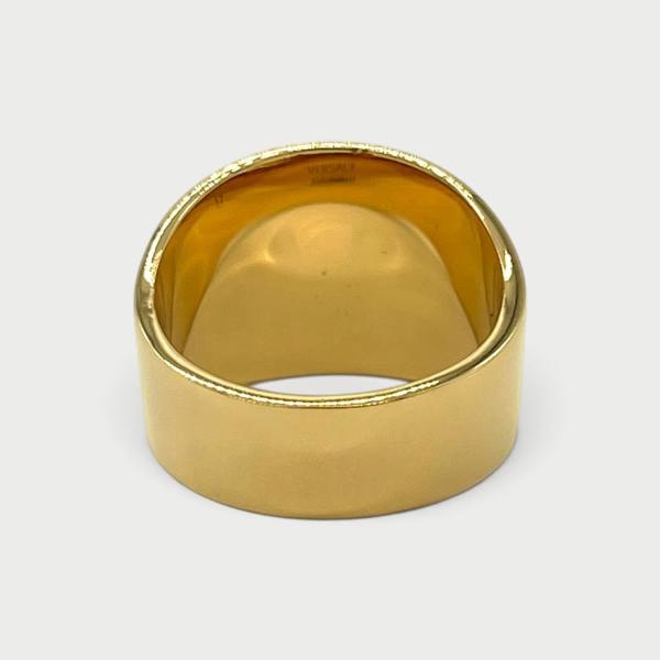 Supplied Fashion gold Medusa head ring with a wide polished band and iconic motif, viewed from the back.