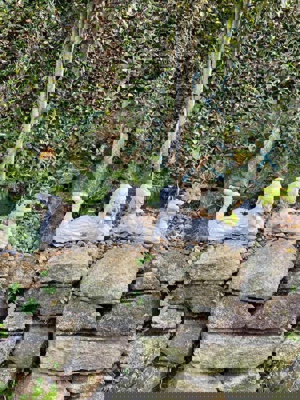 Cheerful Laying Boy and Girl Outdoor Ornament