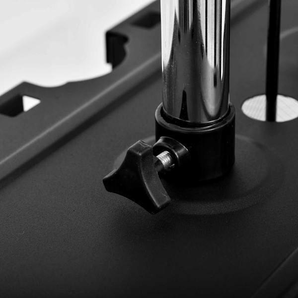 Close-up of black machine base adjustment knob and metal support post