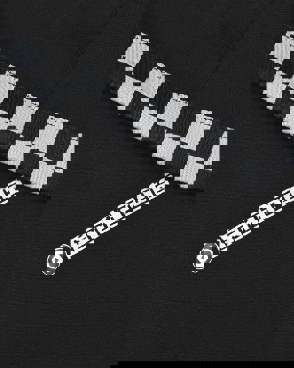 Lambretta Mens Two Tone Taped Casual Mod Ska Casual T-Shirts, close-up of black fabric with checkered black and white tape detail and Lambretta logo.