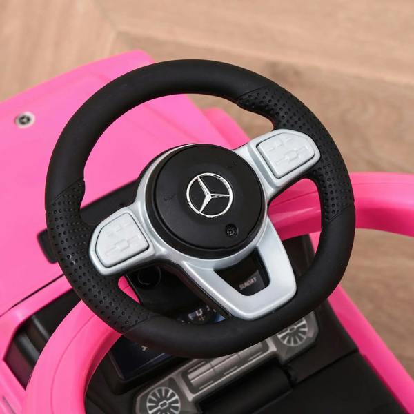 Pink ride-on push car steering wheel with Mercedes emblem and horn buttons