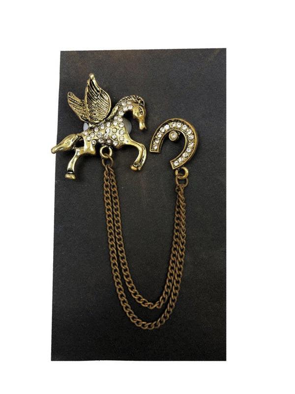 Jewelled Pegasus chain lapel pin by PAMONI featuring a detailed winged horse design with sparkling embellishments.
