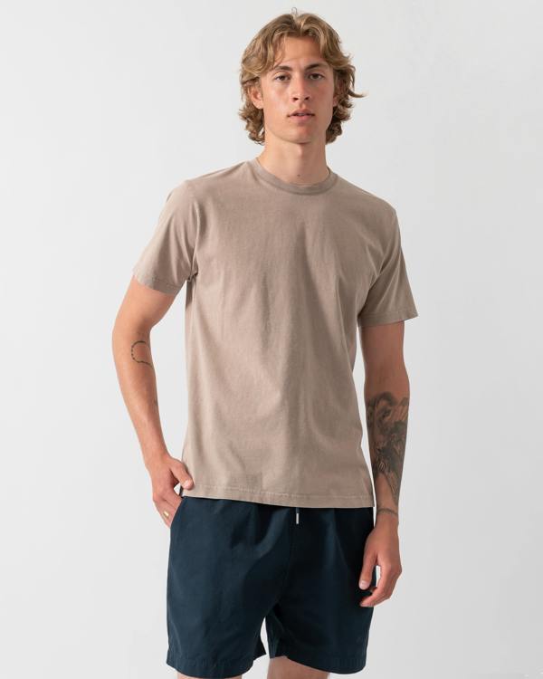 model wearing a Colorful Standard Classic Organic T-Shirt in Faded Khaki