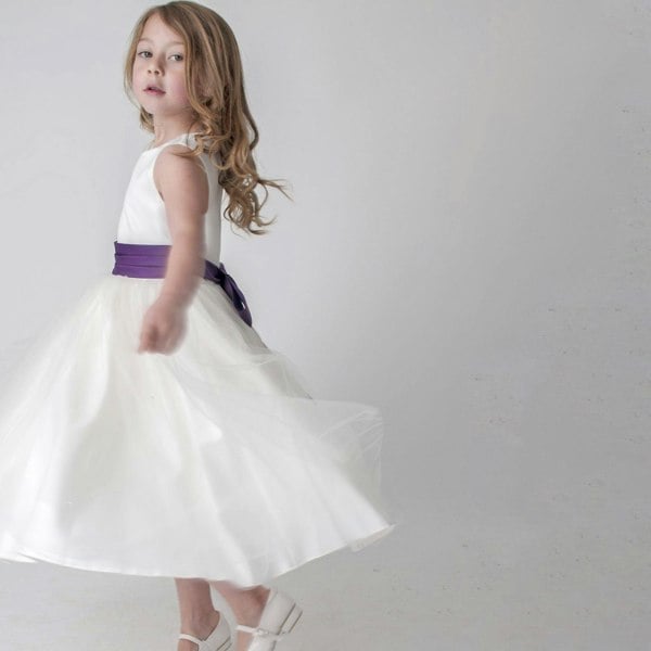 Girl twirling in party dress