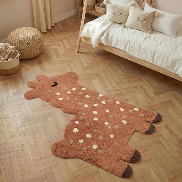 Children's room with a brown animal-shaped rug on a wooden floor.