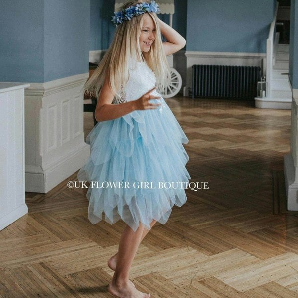 Gril dancing in a blue and white bohemian party dress