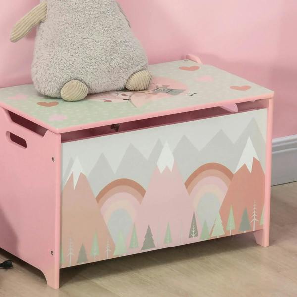 Pink kids toy box with hinged lid and rainbow forest panel, close-up front corner