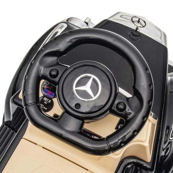 Black Mercedes-Benz 300S steering wheel with Mercedes logo and control panel