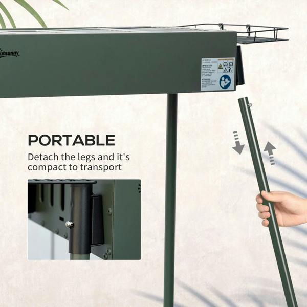 Green portable charcoal BBQ grill with detachable legs for compact transport