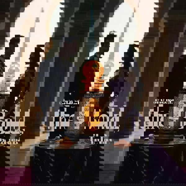 Sapil Royale Oud perfume bottle between a stylish couple