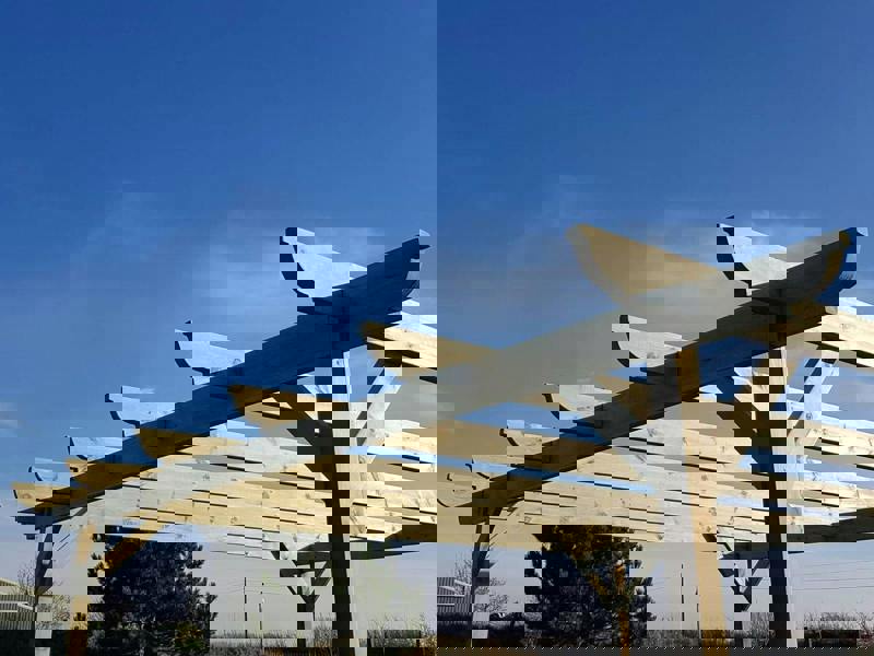 Corbel wooden garden pergola kit made from high quality timber posts and beams, featuring smooth angled edges and an open frame design suitable for patios, gardens, and outdoor seating areas.