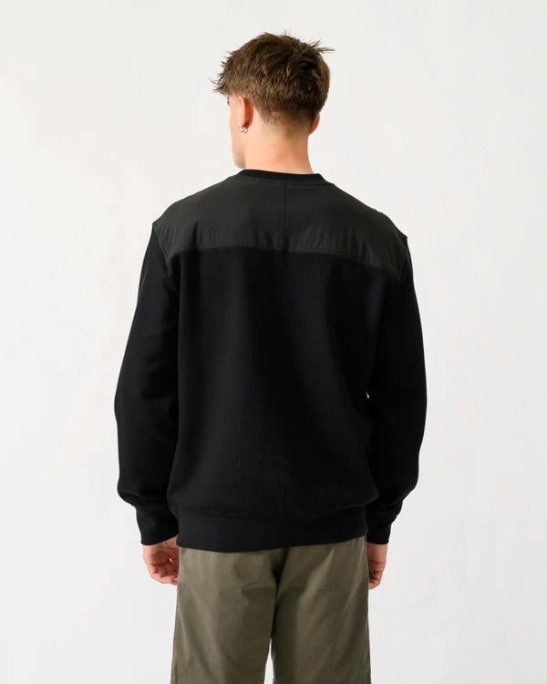 back shot of a model wearing a BOSS Orange We Urban Mens Crew Neck Sweatshirt with Pocket in Black 001