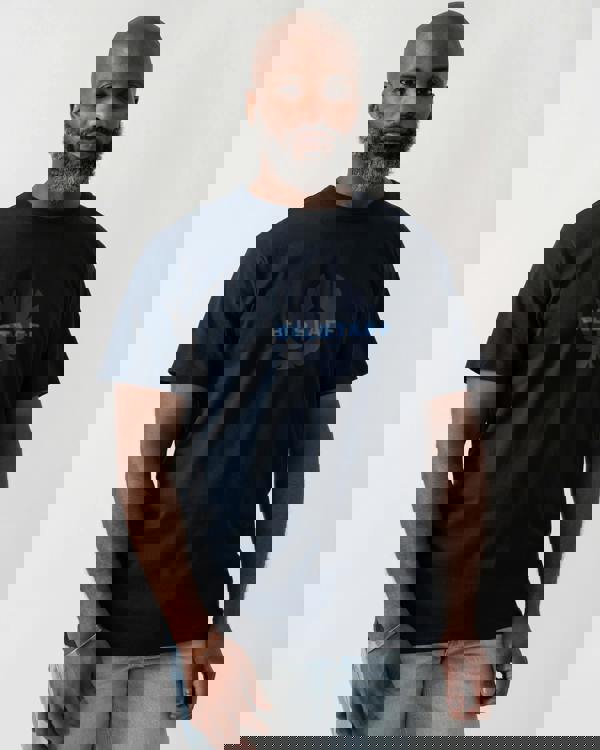 Model wearing a Belstaff Surface Mens T-Shirt in Dark Ink