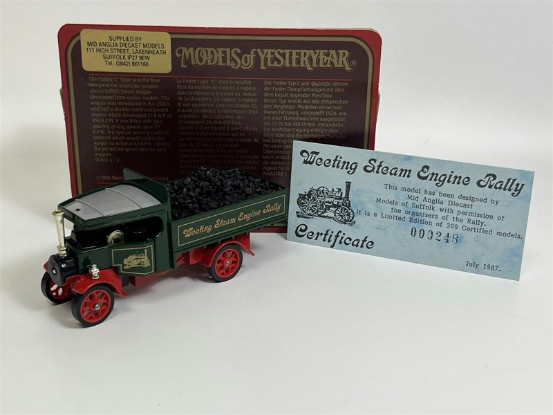 a toy truck with coal in it