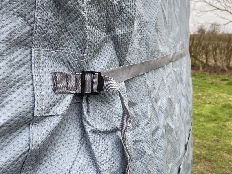 The straps of VW T25/T3/T4/T5/T6 Campervan Cover Grey by OLPRO on a VW T5 with a closeup of the straps that have been tightened.