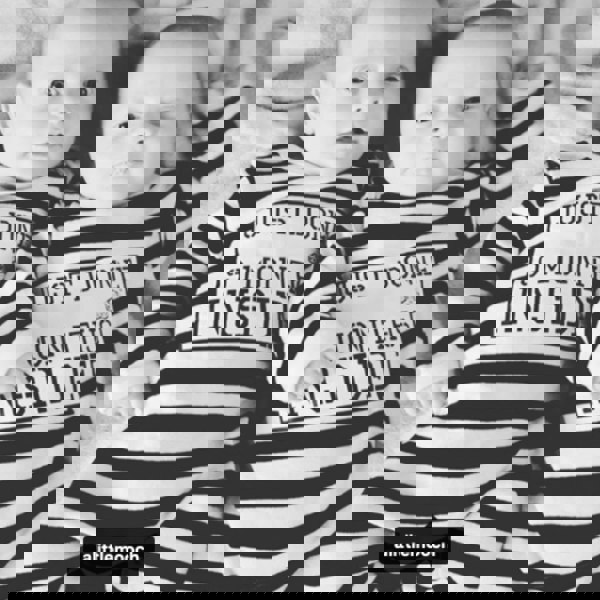 Twins both wearing Just Done 9 Months Inside stripy baby grows