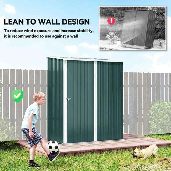 Green corrugated steel shed lean-to-wall design with door and side panels