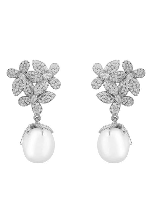 Pair of floral earrings with pearl drops on a white background