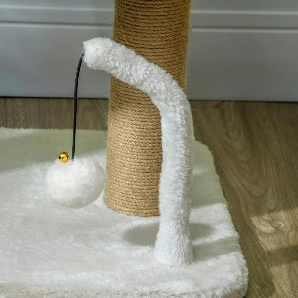 Close-up of curved white scratching cover and hanging ball toy on jute post